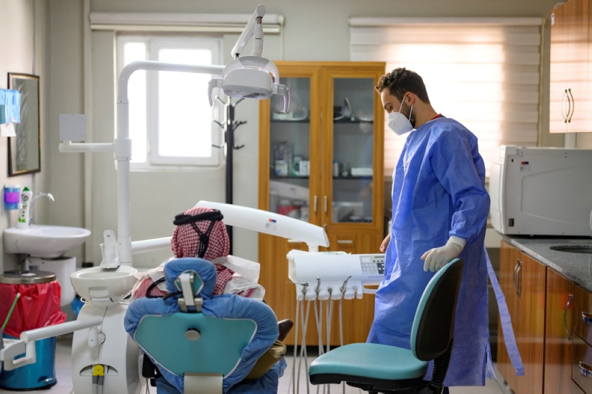 A Syrian refugee attends a dental treatment on Oct 17, 2023.