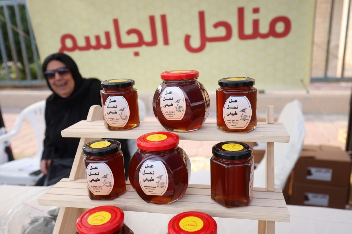 A woman vendor shocases her products.