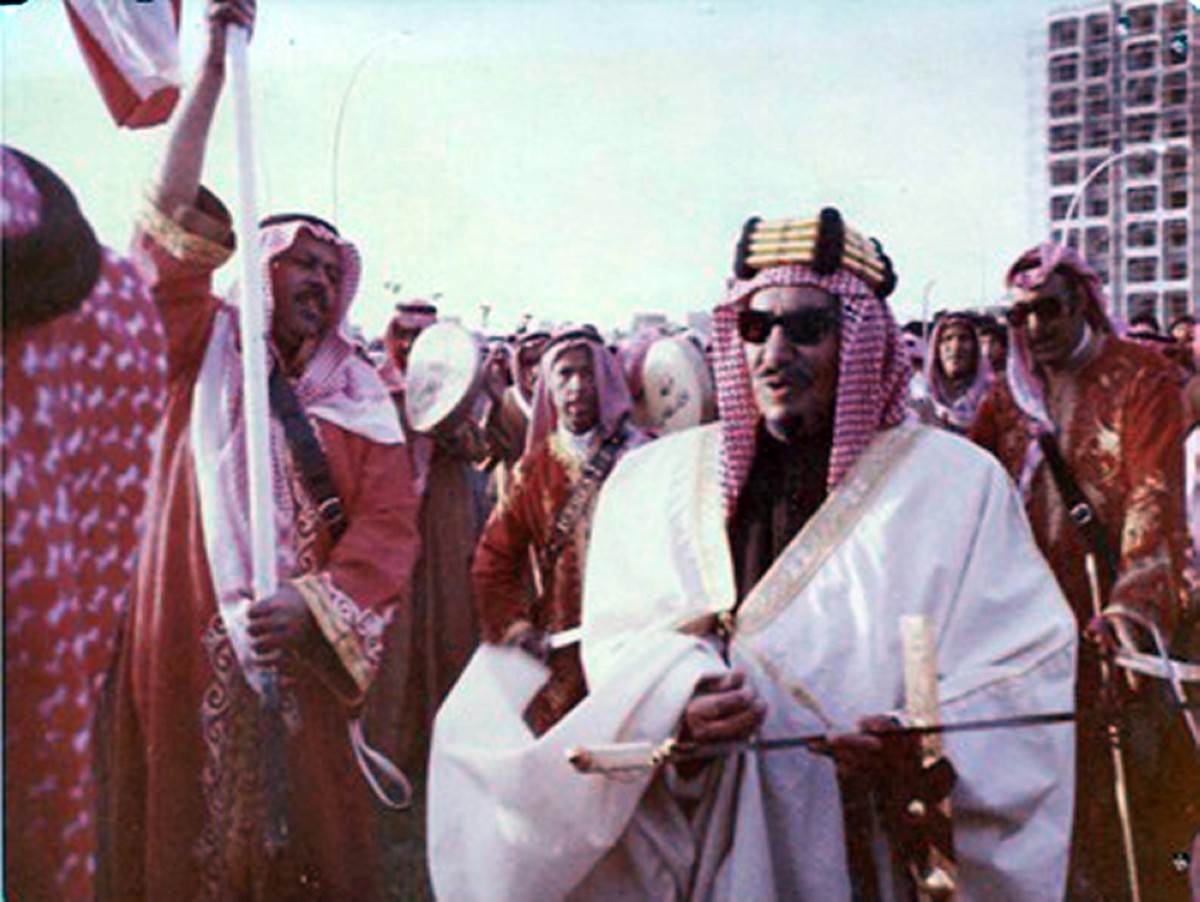 The late Sheikh Abdullah Al-Jaber Al-Sabah, who was the honorary leader of the Awlad Amer band, is seen with them during an event.

