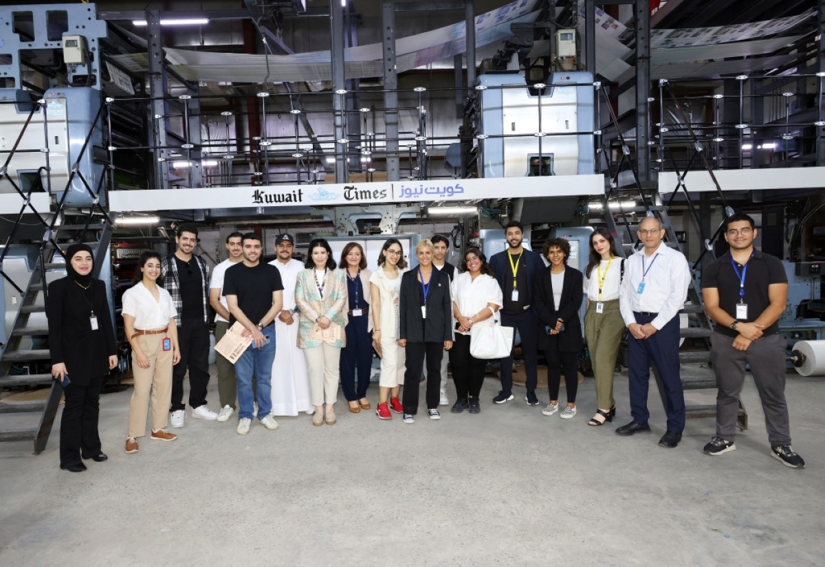 AU marketing students gather for a group photo with Kuwait Times team.