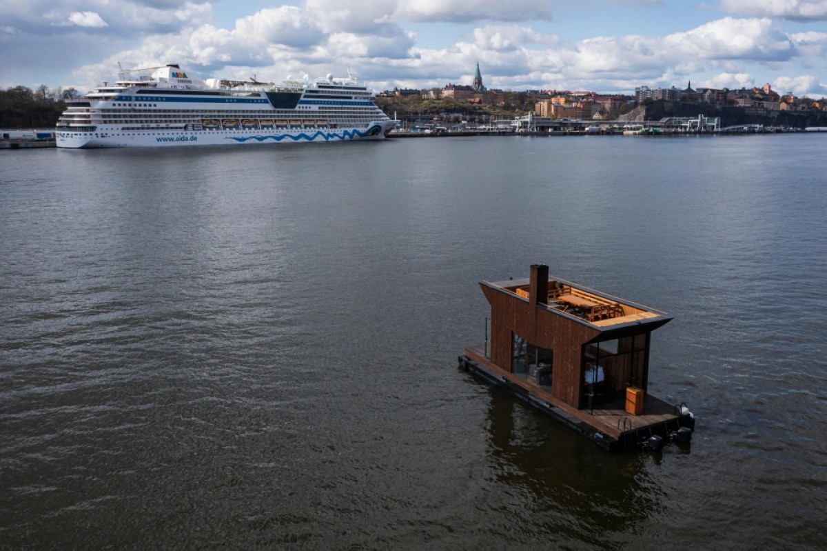This aerial image shows the "Big Branzino", a luxe floating sauna measuring 30 square metres, as it floats in the waters of the Swedish capital, Stockholm.—AFP photos