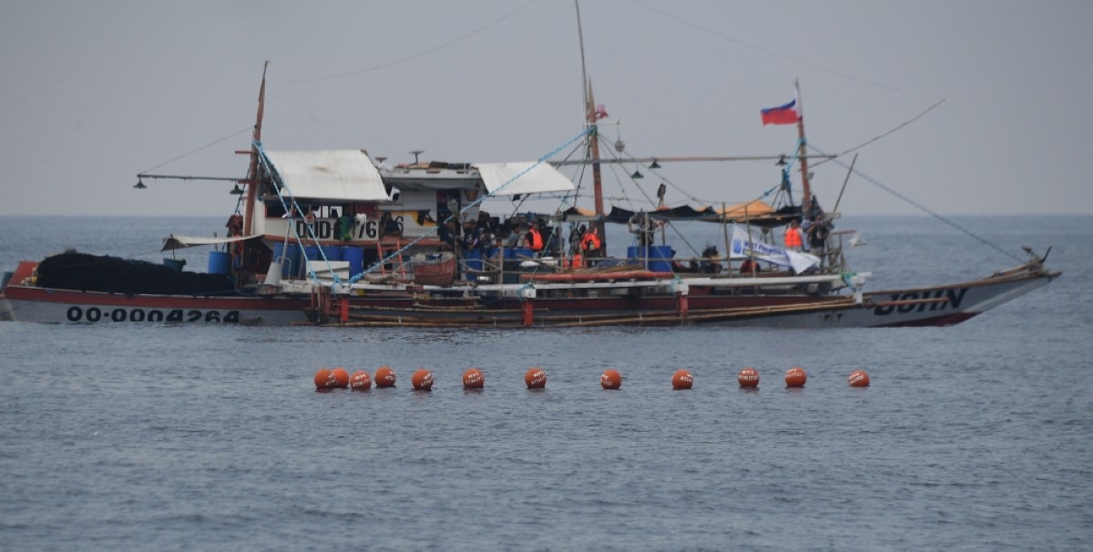 Philippine civilian convoy sails towards disputed reef