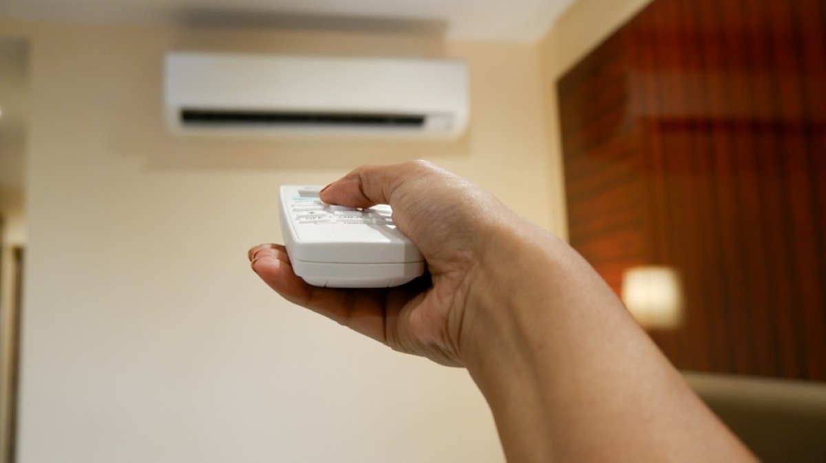 Concept of turning on or off ac or air conditioner by remote control.