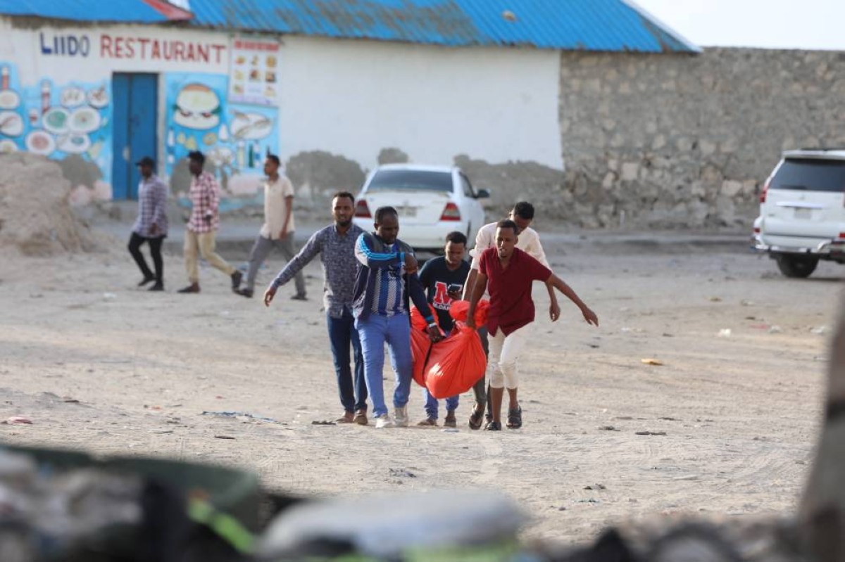 MOGADISHU: Relatives carry the body of a woman killed during an attack in Mogadishu on August 3, 2024. -AFP
