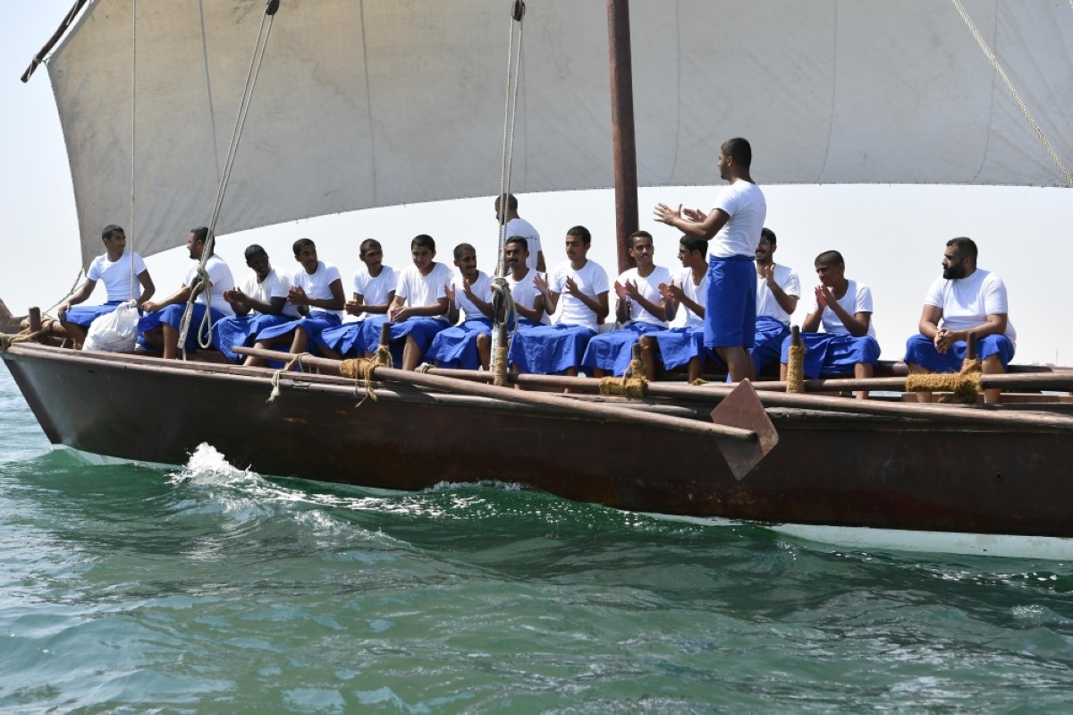 Participants of pearl diving trip performing a folklore dance.