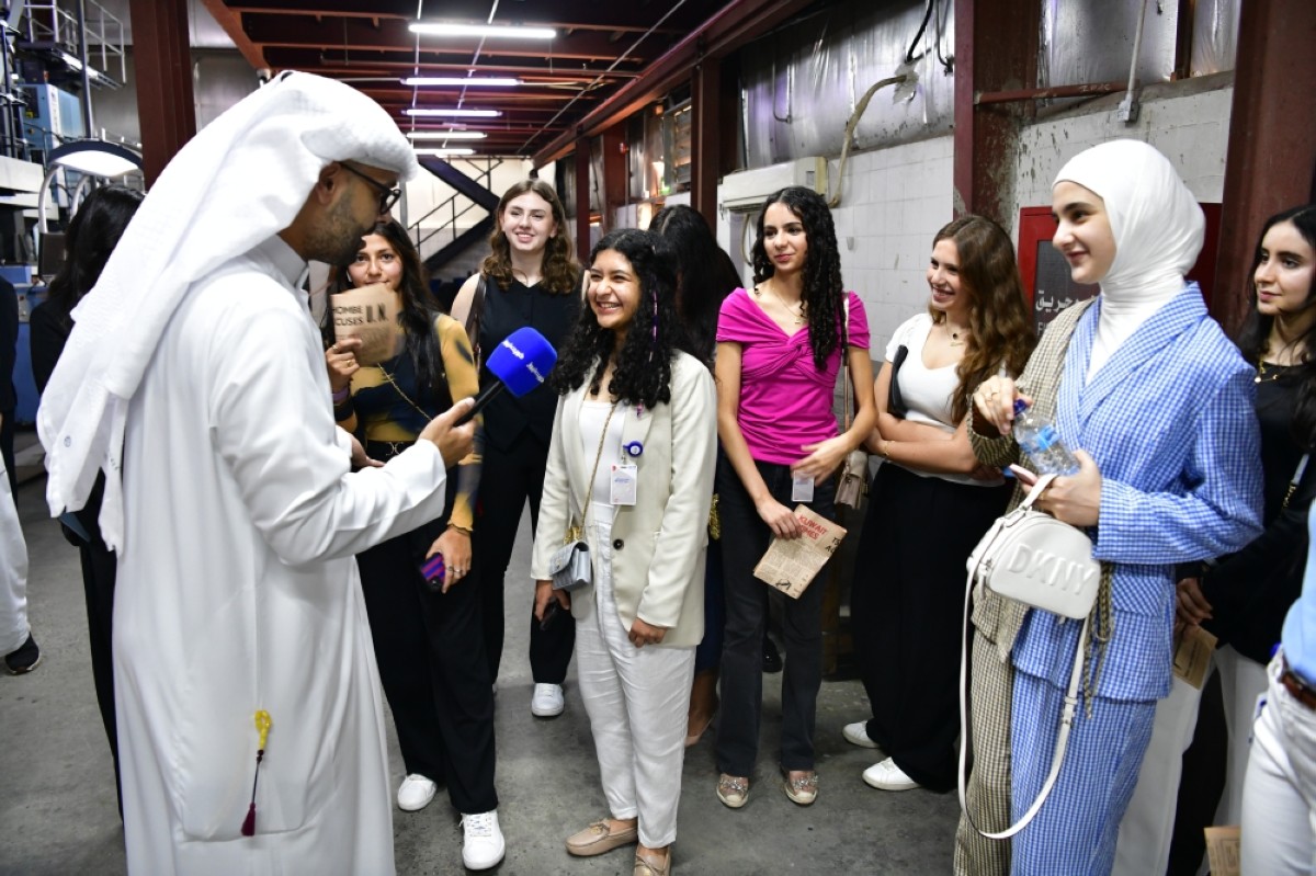 Kuwait News content creator Ahmad Hadi interviewing the students.