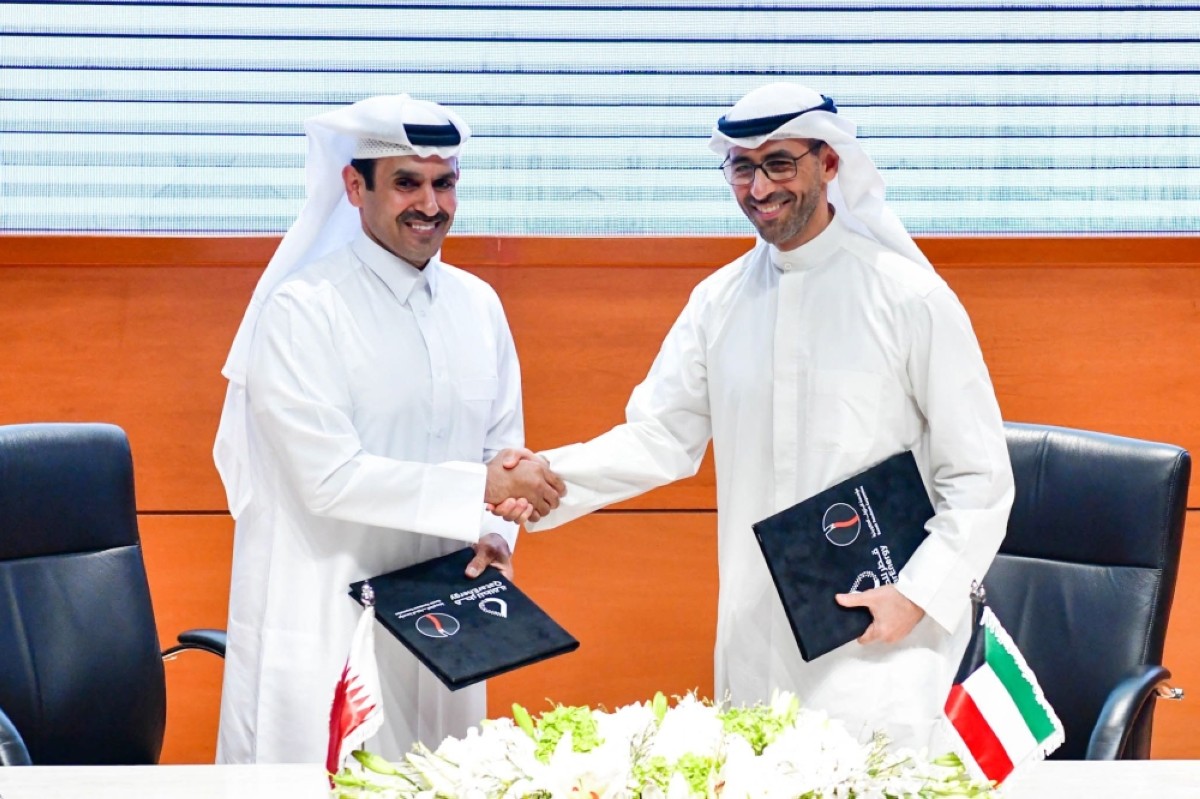 KPC CEO Sheikh Nawaf Al-Sabah and Kaabi shake hands during a signing ceremony at KPC headquarters on Aug 26, 2024. – KUNA