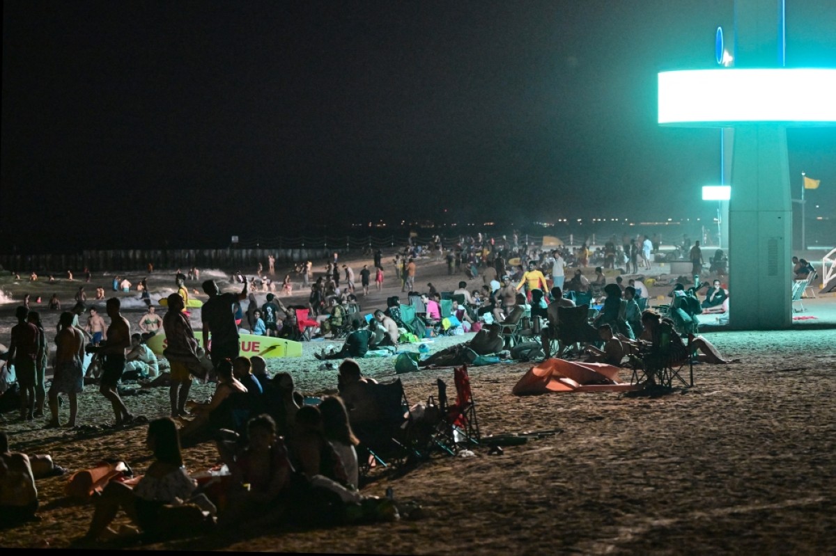 Too hot by day, Dubai’s floodlit beaches are packed at night