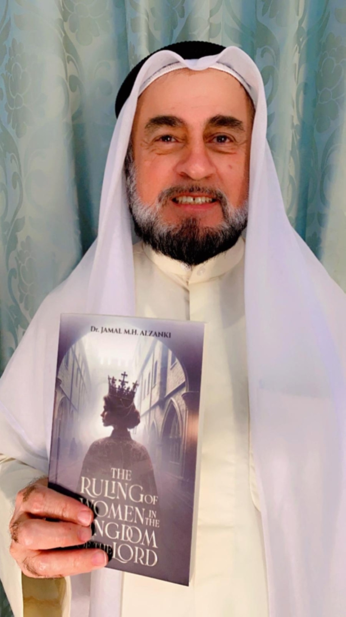 Jamal AlZanki with his book.