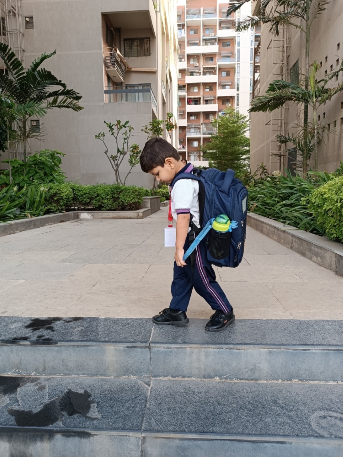 A frustrated child carries a heavy school bag in this illustrative image.