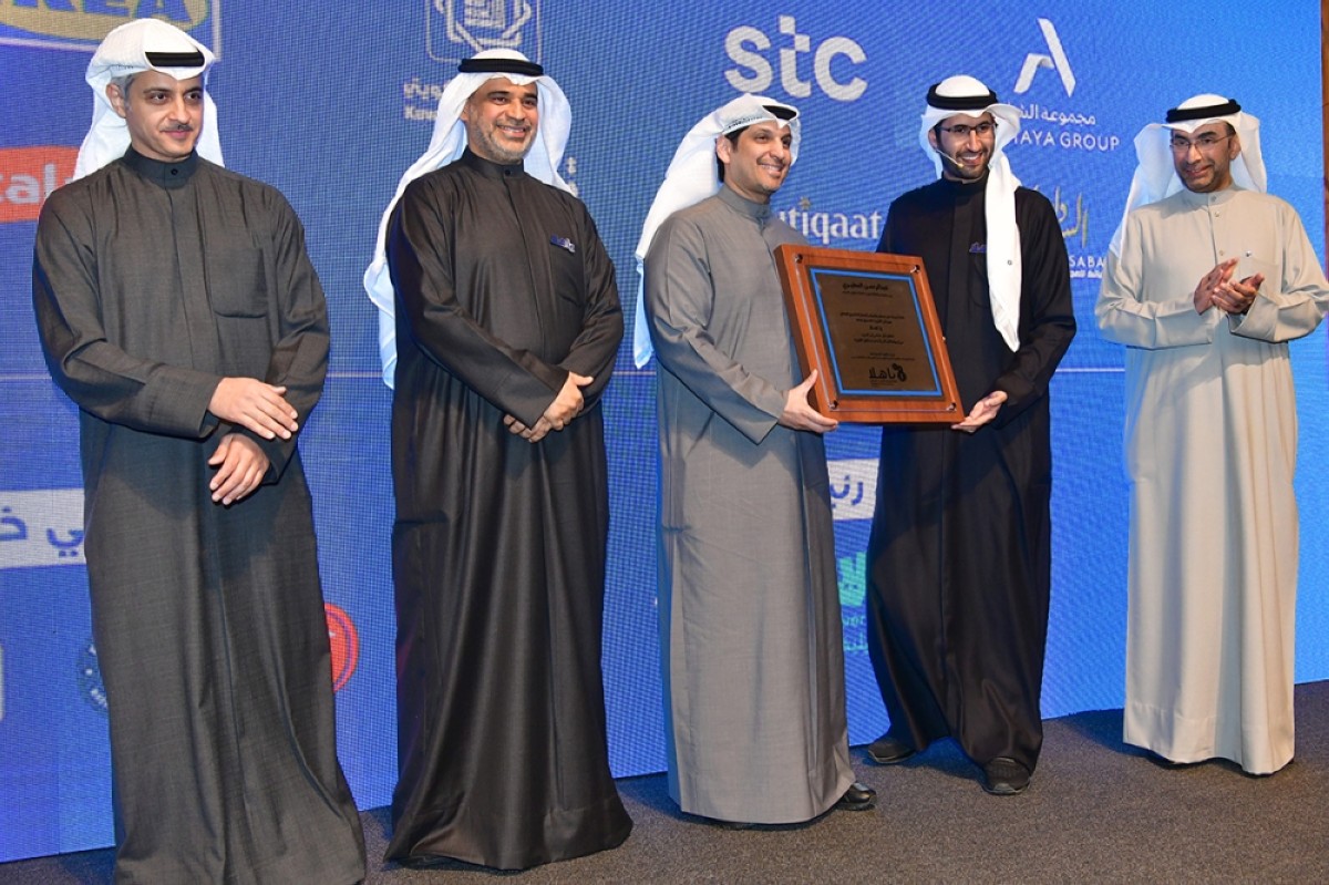 Officials honor Minister of Information Abdulrahman Al-Mutairi (center) during the launch event. 