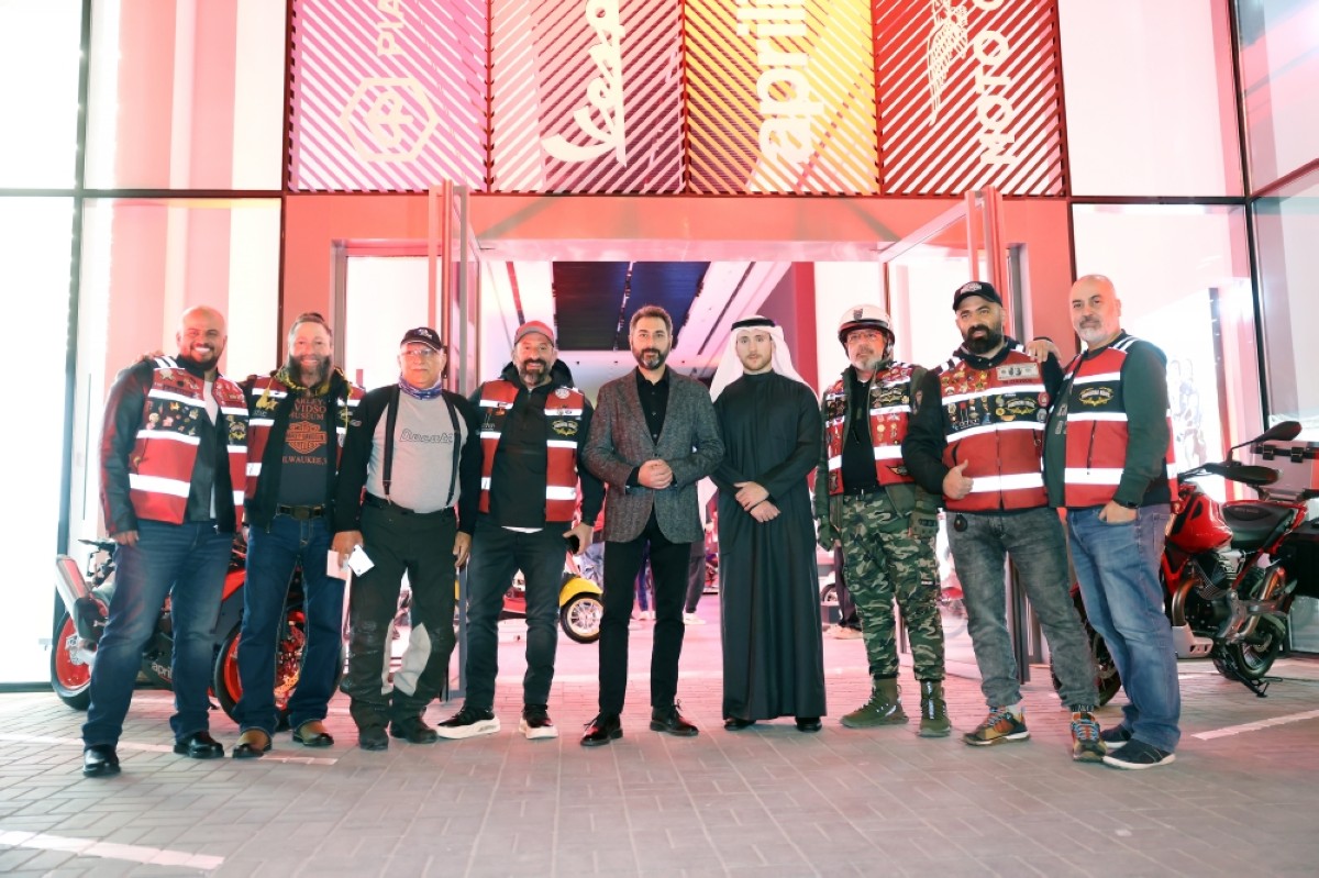 KUWAIT: Ashraf Tamimi (center) and Alexander Qabazard (center right) take a photo with bikers at the event held to unveil the new BNK Motion Motoplex. — Photos by Yasser Al-Zayyat