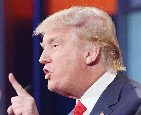 (FILES) Real estate tycoon Donald Trump speaks during the prime time Republican presidential debate in this August 6, 2015, file photo at the Quicken Loans Arena in Cleveland, Ohio. Donald Trump was scratched from a Republican Party event Saturday after suggesting that a presidential debate moderator was tough on him because she was menstruating. The off-handed comment unleashed a new storm of criticism against Trump as he seeks the party's nomination for next year's election and leads in the polls.   AFP PHOTO/MANDEL NGAN/FILES