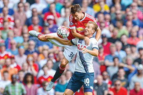 TOPSHOTSnManchester United's Italian defender Matteo Darmian (up) vies with Tottenham Hotspur's English striker Harry Kane during the English Premier League football match between Manchester United and Tottenham Hotspur at Old Trafford in Manchester, north west England, on August 8, 2015. AFP PHOTO / OLI SCARFFnnRESTRICTED TO EDITORIAL USE. No use with unauthorized audio, video, data, fixture lists, club/league logos or 'live' services. Online in-match use limited to 75 images, no video emulation. No use in betting, games or single club/league/player publications.