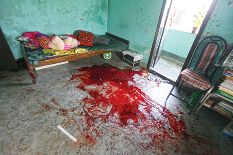 Blood is seen on the floor where Bangladeshi blogger Niloy Chakrabarti, who used the pen-name Niloy Neel, was murdered at his home in Dhaka on August 7, 2015.  A gang armed with machetes hacked a secular blogger to death at his home in Dhaka August 7, 2015, sparking protests in the capital over the fourth such murder in Bangladesh this year.    AFP PHOTO
