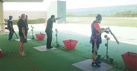 Fuhaid Al-Daihani (center) shoot during a training session