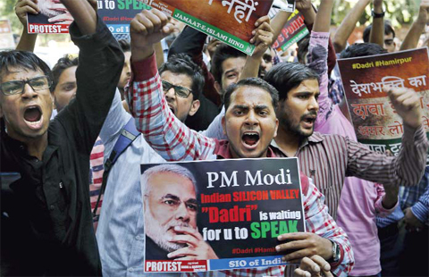 NEW DELHI: In this Oct. 6, 2015 file photo, activists of various Indian Muslim groups shout slogans against Indian prime minister Narendra Modi during a protest against the killing of a Muslim farmer by villagers upon hearing rumors that the family was eating beef, in New Delhi, India. The chorus of Indian intellectuals protesting religious bigotry and communal violence grows louder by the week with a single message for prime minister Narendra Modi: Assure the multicultural nation that the government stands for secularism and diversity. — AP