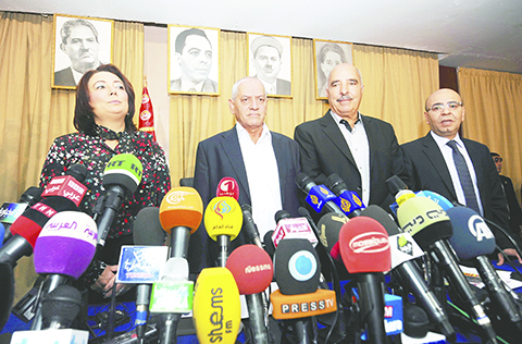 (FILES) A photo taken on September 21, 2013 shows Tunisian mediators (LtoR) the President of the Tunisian employers union (UTICA), Wided Bouchamaoui, Secretary General of the Tunisian General Labour Union (UGTT) Houcine Abbassi (L) , President of the Tunisian Human Rights League (LTDH), Abdessattar ben Moussa and the president of the National Bar Association, Mohamed Fadhel Mahmoud at a press conference in Tunis. Tunisian national dialogue mediators won the 2015 Nobel Peace Prize, the Norwegian Nobel Commitee announced on October 9, 2015. AFP PHOTO / FETHI BELAID