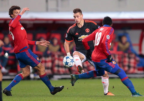 Manchester United’s Morgan Schneiderlin (centre) takes on CSKA’s Roman Eremenko (left) and Ahmed Musa during their Champions League Group B soccer match. –AP