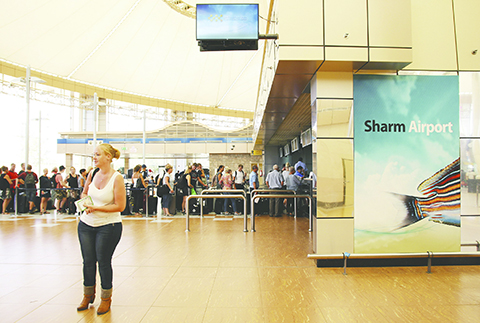 Tourists wait in the departure hall to be evacuated from Sharm el-Sheikh airport, south Sinai, Egypt, Friday, Nov. 6, 2015. Egyptian police carried out detailed security checks on Friday at the airport in Sharm el-Sheikh, the resort from where the doomed Russian plane took off last weekend, after U.K. officials confirmed that flights will start bringing stranded British tourists home from the Sinai Peninsula. (AP Photo/ Vinciane Jacquet)