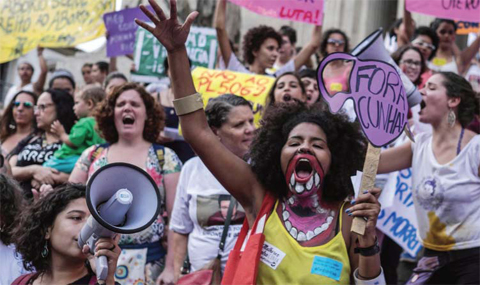 RIO DE JANEIRO: Brazilian women demonstrate in favor of abort legalization and against the president of the Brazilian Chamber of Deputies, Eduardo Cunha, in Rio de Janeiro downtown on November 11, 2015. — AFP