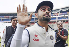 BANGALORE: Captain of the Indian cricket Test team Virat Kohli waves to supporters after rains led to a draw of the second Test cricket match between India and South Africa at The M. Chinnaswamy Stadium in Bangalore yesterday. — AFP