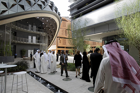 FILE - In this Sunday, Jan. 16, 2011 file photo, visitors of different nationalities visit the Masdar Institute campus,  part of Masdar City in Abu Dhabi, United Arab Emirates.  Israel will soon open an office at a renewable energy agency in Abu Dhabi, the capital of the United Arab Emirates ó even though the two nations have no diplomatic relations, an Israeli Foreign Ministry spokesman said Friday, Nov. 27, 2015. According to the spokesman, Emmanuel Nahshon, the office will be accredited to IRENA, the International Renewable Energy Agency which has has set up a base in Masdar City, a government-backed clean energy campus just outside of the capital, Abu Dhabi. (AP Photo/Kamran Jebreili, File)