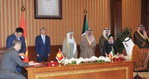 KUWAIT: Deputy Prime Minister, Minister of Finance and Acting Oil Minister Anas Al-Saleh and Kyrgyz Foreign Minister Erlan Abdyldeav sign an agreement in presence of His Highness the Amir Sheikh Sabah Al-Ahmad Al-Sabah, Kyrgyz President Almazbek Atambayev, His Highness the Crown Prince Sheikh Nawaf Al-Ahmad Al-Sabah, His Highness the Prime Minister Sheikh Jaber Al-Mubarak Al-Sabah and First Deputy Prime Minister and Foreign Minister Sheikh Sabah Al-Khaled Al-Sabah. – Amiri Diwan photosn