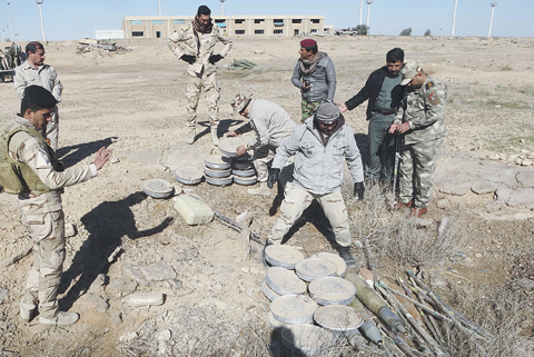 ANBAR: Security forces prepare to destroy collected bombs and explosives being planted by Islamic State militants outside Ramadi, the capital of Iraq’s Anbar province, 70 miles west of Baghdad, Iraq. —AP