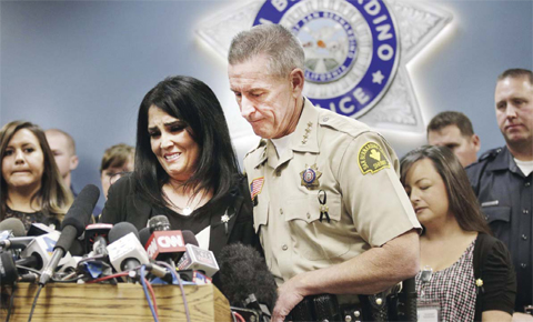 SAN BERNARDINO: San Bernardino County Sheriff John McMahon, right, comforts dispatcher Michelle Rodriguez during a news conference with the first responders who were at the scene of last week’s fatal shooting at the Inland Regional Center. — AP