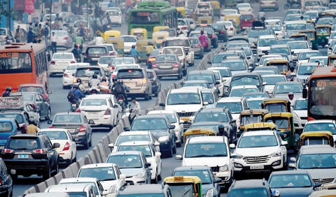 NEW DELHI: In this photograph taken on October 15, 2015, commuters in their vehicles clog the roads. — AFP