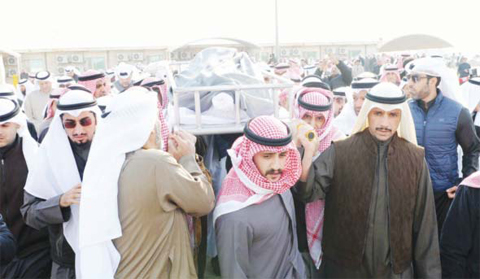 KUWAIT: National Assembly Speaker Marzouq Al- Ghanem (right) and other mourners carry the bier during the burial of MP Nabil Al-Fadhl yesterday.