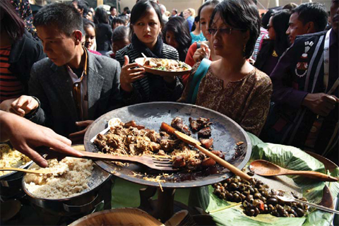 In this photograph taken on November 7, 2015, visitors sample a variety of dishes at The Indigenous Mei-Ramew Food Festival in Mawphlang in India’s northeastern state of Meghalaya. — AFP photos
