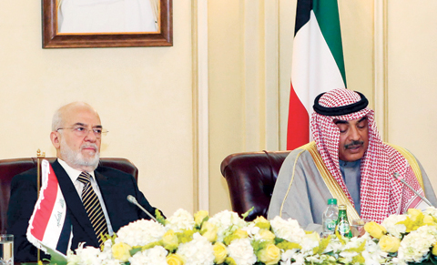 KUWAIT: Iraqi Foreign Minister Ibrahim Al-Jaafari (left) and his Kuwaiti counterpart Sheikh Sabah Al-Khaled Al-Sabah attend the fifth session of the Iraqi-Kuwaiti Joint Supreme Ministerial Committee yesterday. — Photo by Yasser Al-Zayyat