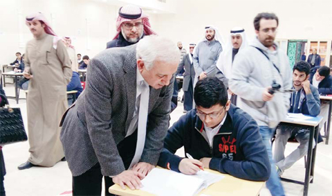 Minister of Education and Minister of Higher Education Dr Bader Al-Essa is pictured while attending to students during his official tour to schools.