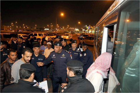 KUWAIT: Officers are seen during a crackdown against violating labor forces in Ardiya.