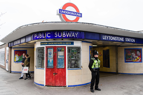 LONDON: A police officer stands guard outside Leytonstone station in north London yesterday, a day after three people were stabbed.  - AFP n