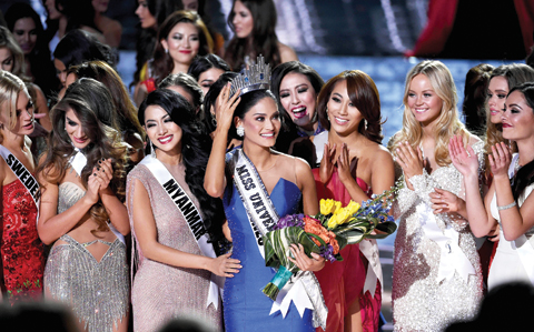 Miss Philippines 2015, Pia Alonzo Wurtzbach (center), who was mistakenly named as First Runner-up reacts with other contestants after being named the 2015 Miss Universe.