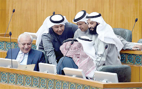 KUWAIT: Education minister Dr Bader Al-Essa (left) appears with a number of MPs during yesterday’s parliament session. —Photo by Yasser Al-Zayyat