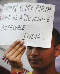 An Indian protester holds a placard during a demonstration against the release of a juvenile rapist in New Delhi yesterday. — AFP