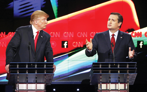 LAS VEGAS: Donald Trump watches as Ted Cruz speaks during the CNN Republican presidential debate at the Venetian Hotel & Casino. — AP