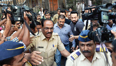 Indian Bollywood actor Salman Khan (center) walks from Bombay High Court in Mumbai yesterday, after being acquitted of culpable homicide. — AFP