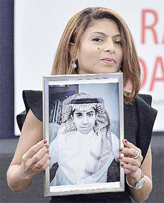 Ensaf Haidar holds a picture of her husband Raif Badawi after accepting the European Parliament’s Sakharov human rights prize on behalf of her husband, at the European Parliament. —AFP