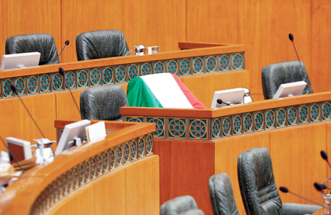 The Kuwaiti flag is placed over the seat of Fadhl in the Assembly. — Photos by Yasser Al-Zayyat
