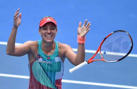 MELBOURNE: Germany's Angelique Kerber celebrates after victory in her women's singles match against Belarus's Victoria Azarenka on day ten of the 2016 Australian Open tennis tournament in Melbourne yesterday. -- AFP 