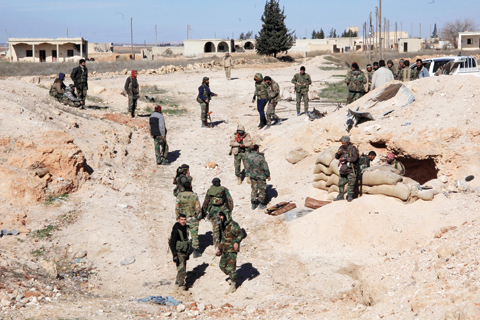 AIN AL-HANASH: Syrian pro-government troops hold positions in the Syrian town of Ain Al-Hanash near l-Bab in Aleppo’s eastern countryside as regime forces have recaptured the area from Islamist jihadists.— AFP