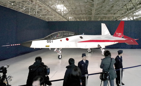 TOYOYAMA: The first domestically-made stealth aircraft, X-2, is shown to the media at Nagoya Airport in Toyoyama town, central Japan, yesterday. —AP
