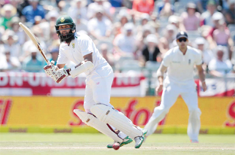 CAPE TOWN: South African batsman and Captain Hashim Amla plays a shot during the third days play in the second Test cricket match between England and South Africa at the Newlands stadium yesterday in Cape Town, South Africa. — AFP