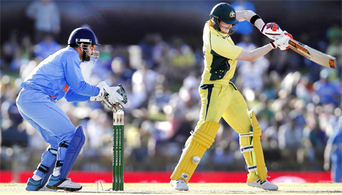 PERTH: Australia’s Steve Smith, right, attempts to play a shot against India during their one day international cricket match in Perth, Australia, yesterday. — AP