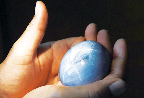 COLOMBO: The world’s biggest blue star sapphire, the Lankan Star of Adam, is shown by its owner in Colombo. A Sri Lankan gem trader who owns the world’s largest blue star sapphire has decided to sell the dazzling stone, with a dizzying asking price of $300 million. — AFP